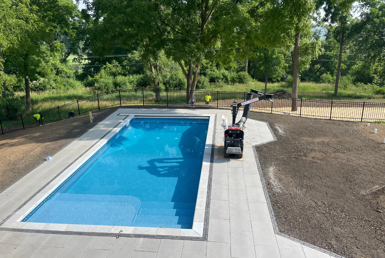 a custom designed pool in waterford wi designed by a pool and landscape company, loomis pools.