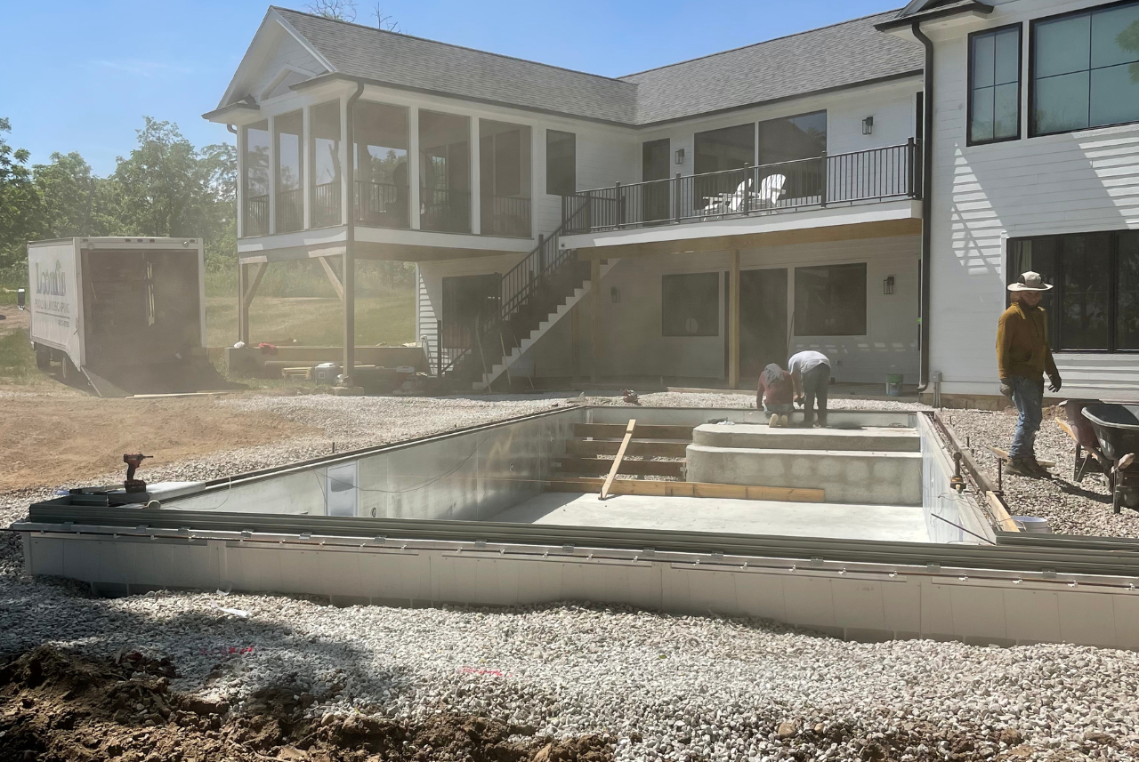 Pool and landscape contractors in SE WI actively constructing a new pool on a residential property.