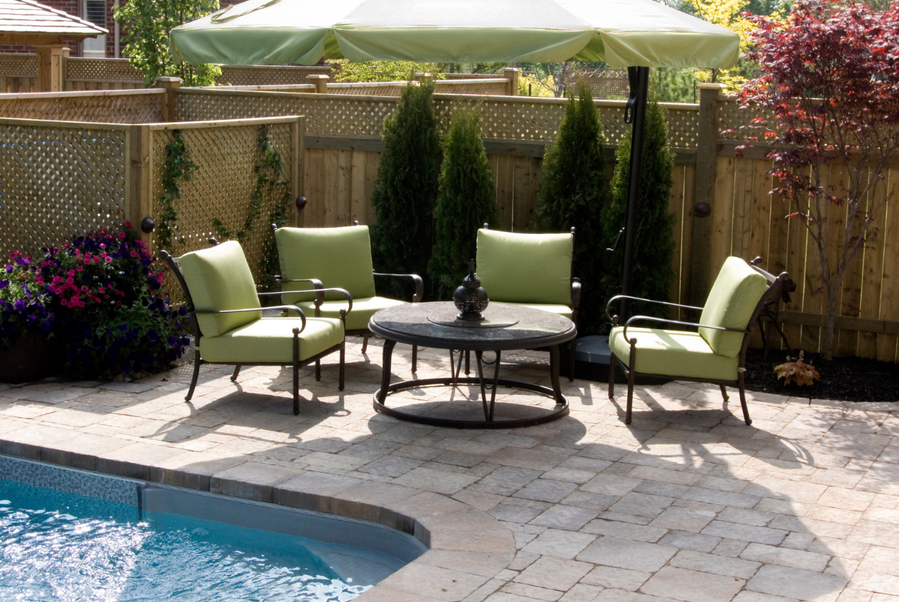 Comfortable poolside seating area for pool maintenance in Waukesha, WI, debunking common pool maintenance myths.