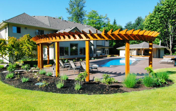 Build a Pool in Your Backyard with a pergola and seating area in SE Wisconsin.
