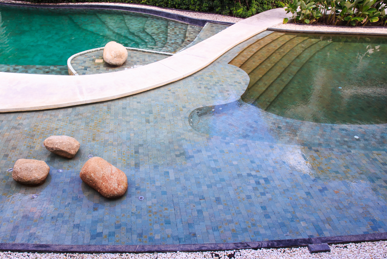 Build a Pool in Your Backyard with unique stone features in SE Wisconsin.