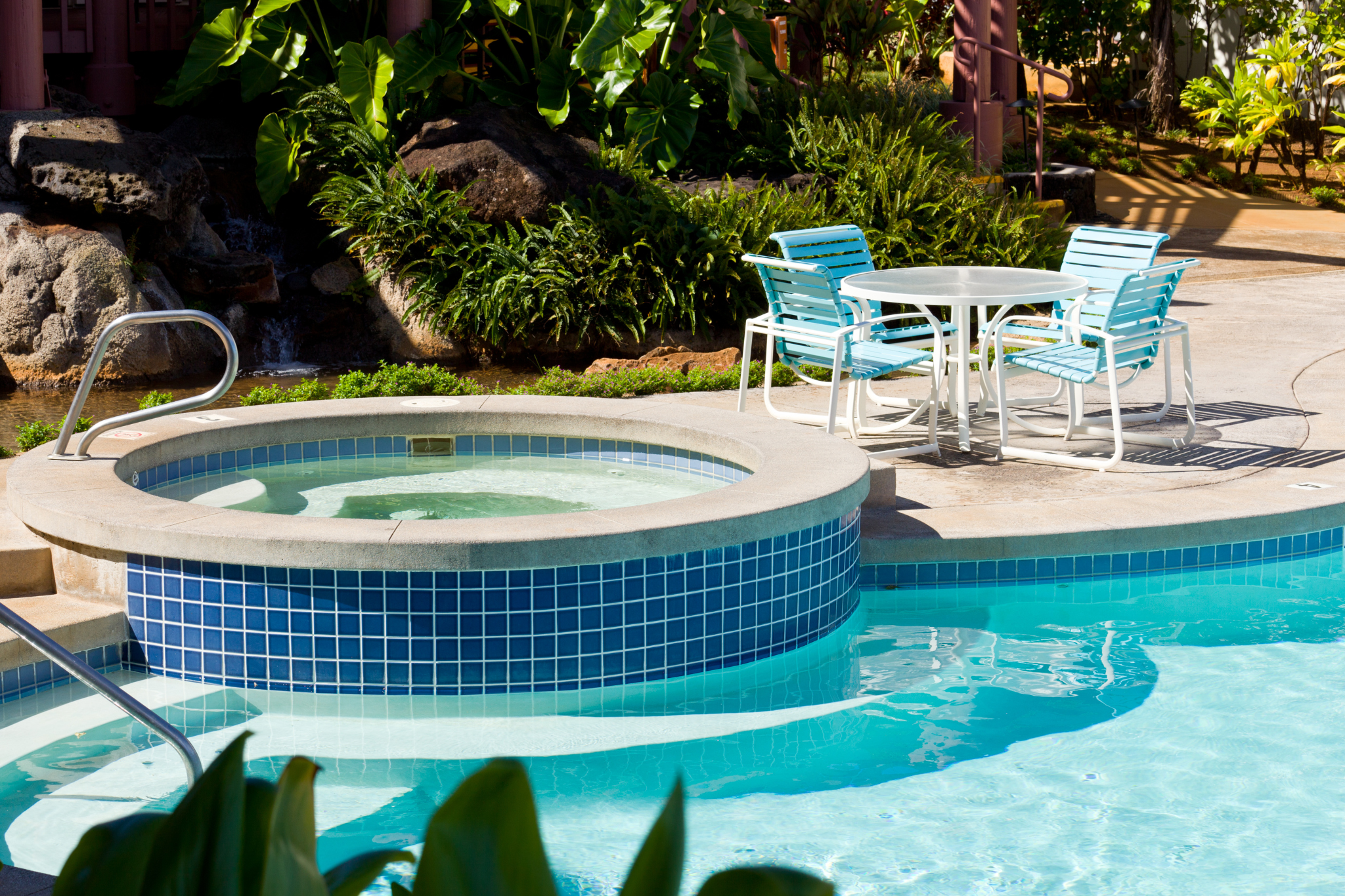 pool with spa on the inside of it